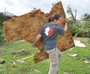 Nicole Green clearing debris after a tornado ripped through the Joplin, Mississippi area. 
